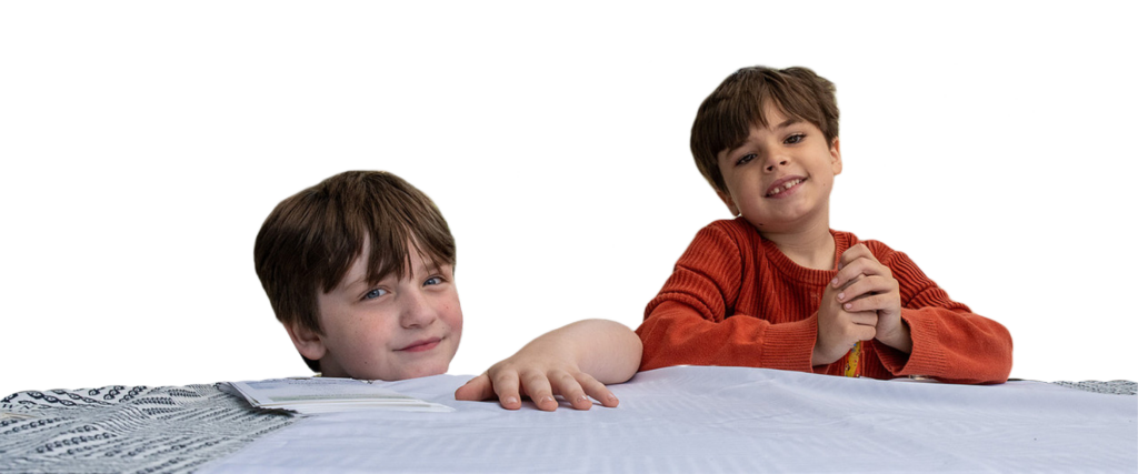 two boys siting at a table
