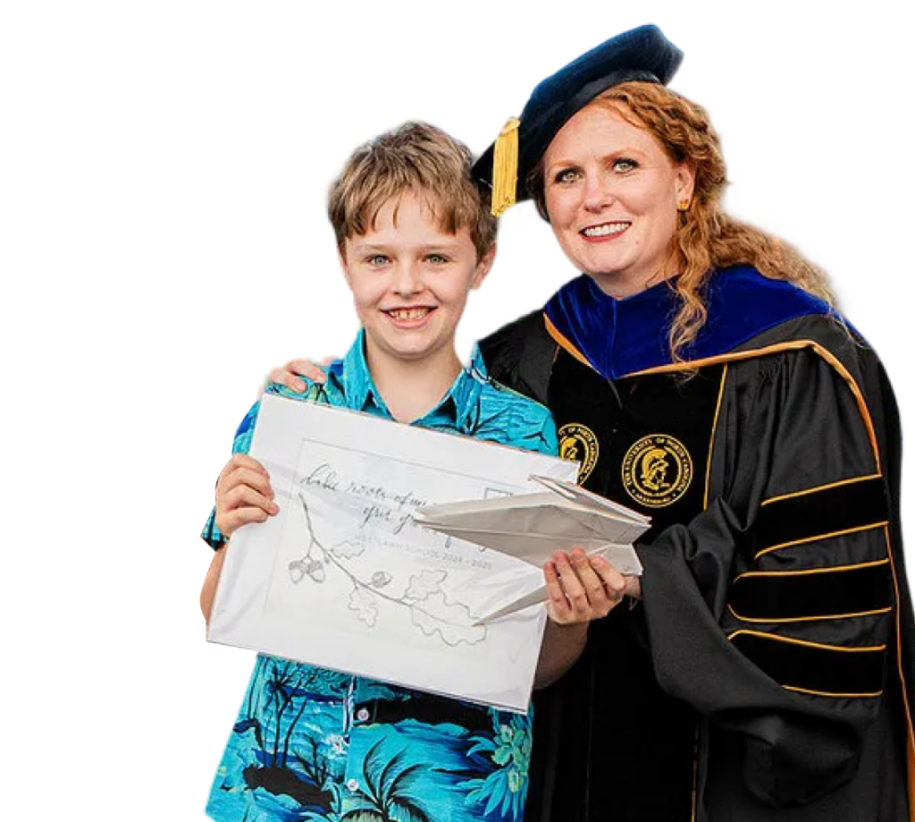 student holding a diploma
