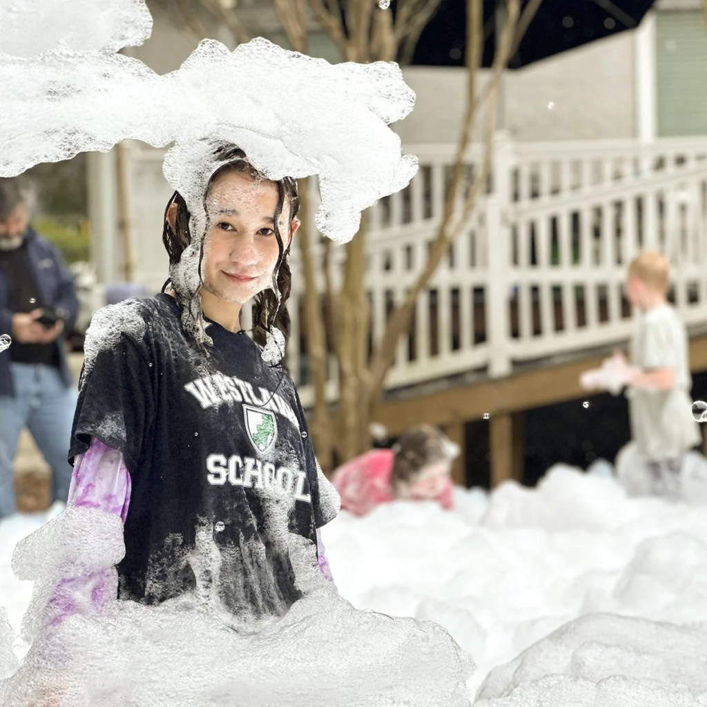 student covered in foam