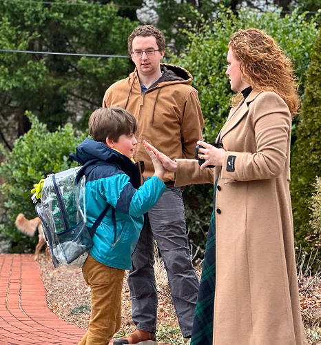 student talking to his parents