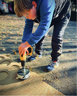 student using a drill 